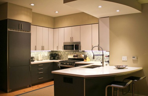 Slab Style Laminate With White Hi-Gloss Laminate And Terra Door Wood Grain Laminate Finish