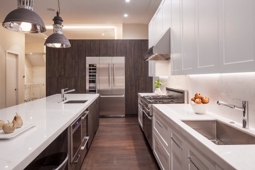 Contemporary kitchen black woodgrain laminate and white shaker door by Bellmont