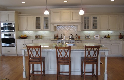 Traditional kitchen painted cabinets with island